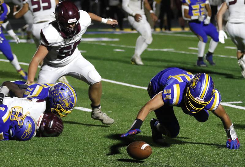 Johnsburg's Duke Mays recovers a fumble by Marengo's David Lopez during a Kishwaukee River Conference football game on Friday, Oct. 4, 2024, at Johnsburg High School.