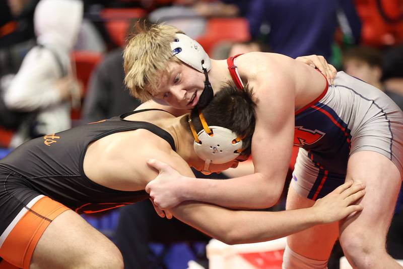 Marmion’s Jack Lesher works over Libertville’s Josh Knudten in the Class 3A 182lb. semifinals at State Farm Center in Champaign. Friday, Feb. 18, 2022, in Champaign.