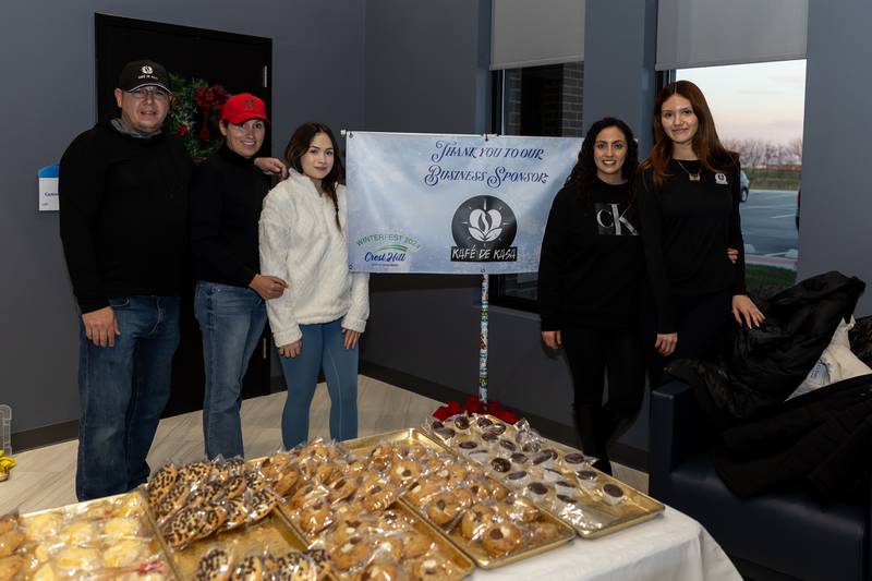 The Kafe De Kasa team shares sweet treats and warm drinks during Winterfest at Crest Hill City Center on Nov. 30, 2024.