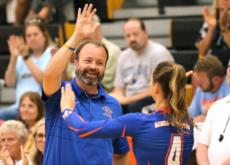 Genoa-Kingston head coach Keith Foster high fives Hannah Langton during their match Monday, Aug. 28, 2023, at Sycamore High School.