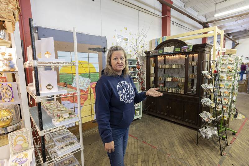 Lori VanOosten, marketing assistant for Sterling Main Street, tours the Twin City Farmers Market in the downtown Saturday, March 25, 2023.