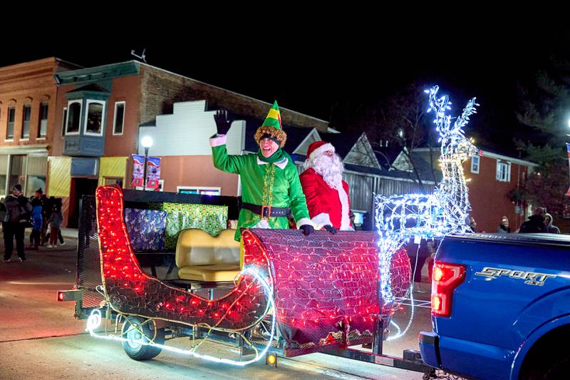 Buddy the Elf rides with Santa Claus on Saturday, Nov. 30, 2024, at the Spring Valley Lighted Christmas Parade.