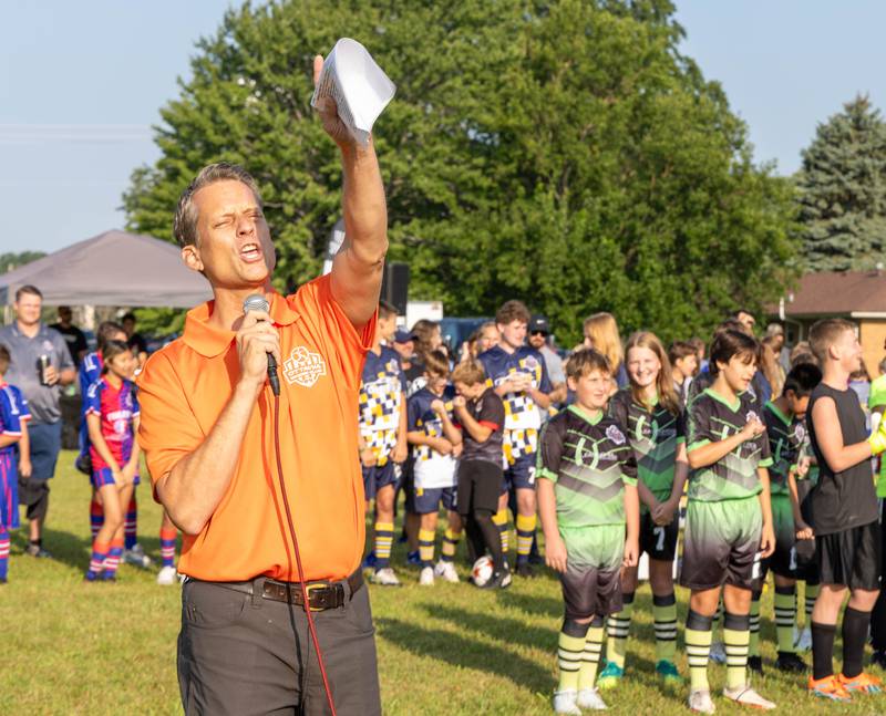 Ottawa Soccer Club President Dave VanWiggeren addresses this season's nearly 600 players and their families Saturday, Aug. 19, 2023, at East McKinley Fields.