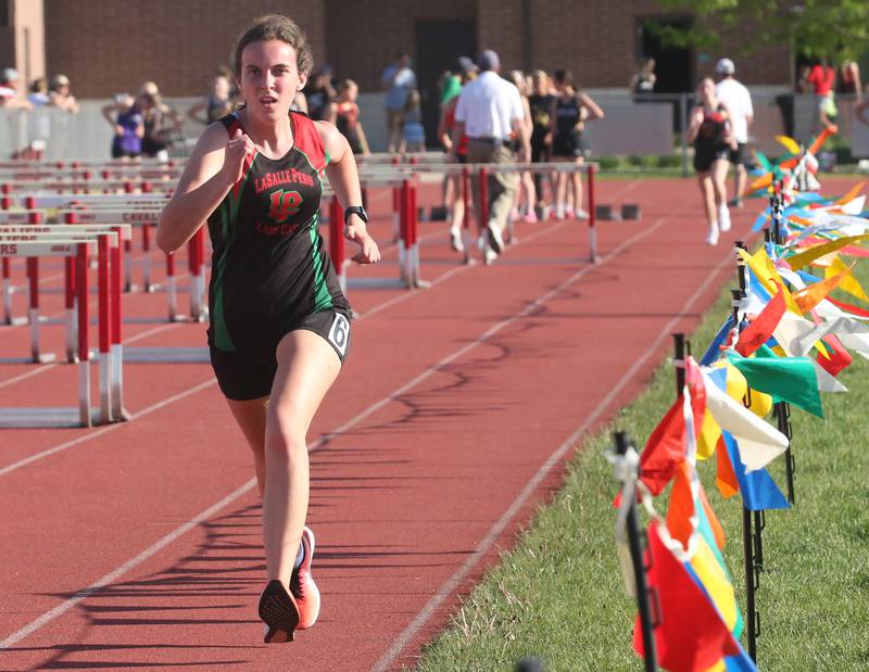 L-P's Sophia Woods runs in the 3200 meter race during the Interstate 8 conference track meet on Friday, May 3, 2024 at the L-P Athletic Complex in La Salle.