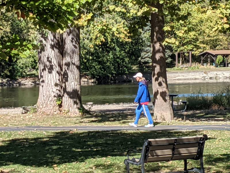 A pedestrian walks on a path in Hudson Crossing Park in downtown Oswego. The Chicago Metropolitan Agency for Planning will be putting together a bicycle and pedestrian plan for the village. At the Oct. 1 Oswego Village Board meeting, village trustees approved an agreement with CMAP to put together the plan.