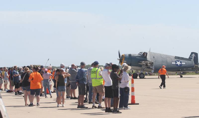 Hundreds of people gather to watch TBM aircrafts depart for the 10th annual TBM Avenger Reunion and Airshow on Friday, May 16, 2025 at the Illinois Valley Regional Airport in Peru.