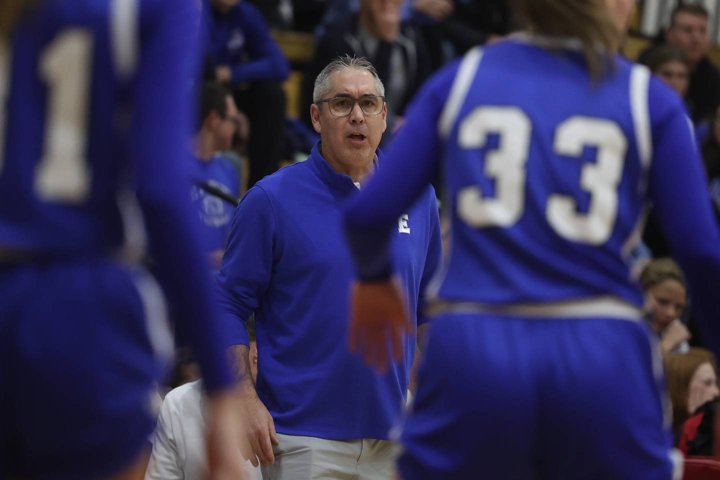 Lincoln-Way East head coach Jim Nair talks to his players during the game against Lincoln-Way Central on Thursday, Jan. 11th, 2024 in New Lenox.