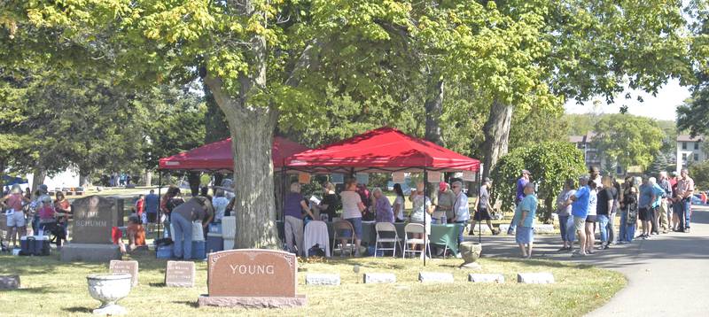A large group waits to begin the cemetery walk sponsored by the Lee County Historical and Genealogical Society at Oakwood Cemetery in Dixon on Sunday, Sept. 28.
