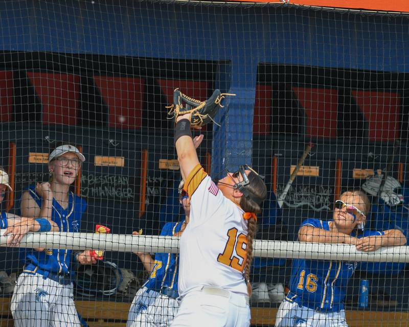Wheaton Warrenville South's Lily Bobor (19) makes a catch in front of Wheaton North’s dugout during the sectional semifinal game on Thursday June 5, 2025, held at Oswego High School.