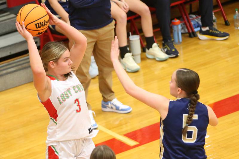 L-P's Emma Jereb looks to pass the ball off around Marquette's Chloe Larson on Saturday, Jan. 4, 2025 in Sellett Gymnasium at L-P High School.