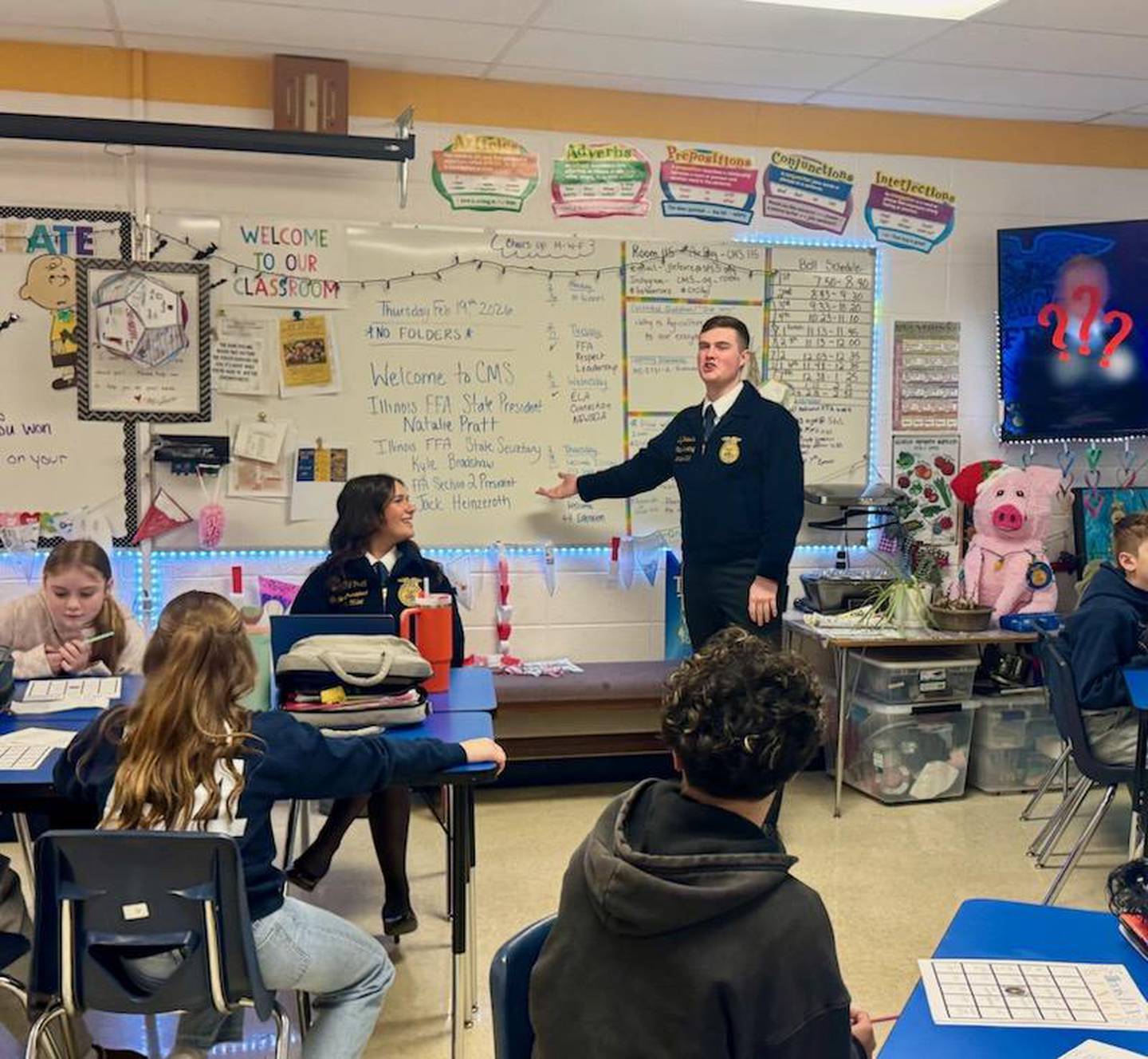 Illinois State FFA Secretary Kyle Bradshaw puts Challand seventh grade agriculture students through their FFA trivia paces as Illinois FFA State President Natalie Pratt looks on. Bradshaw, Pratt and Section 2 President Jack Heinzeroth visited Julie LeFevre's ag classes in preparation for National FFA Week.