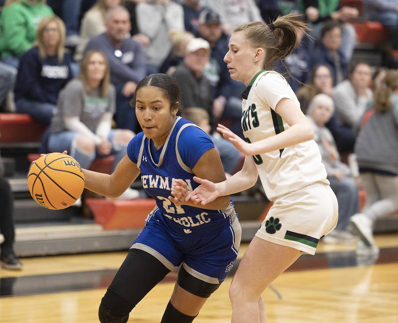 Newman’s Gisselle Martin drives the lane against River Ridge’s Kenley Patterson Thursday, Feb. 20, 2025, during the Class 1A girls basketball regional at Forreston.