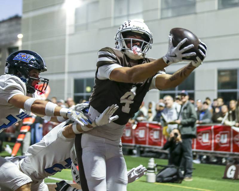 Mount Carmel's Quentin Burrell (4) makes a catch in for a apparent touchdown that was called back because of offsetting penalties during Class 8A quarterfinal football game between Lincoln-Way East at Mount Carmel. Saturday, Nov 15, 2025 in Chicago.