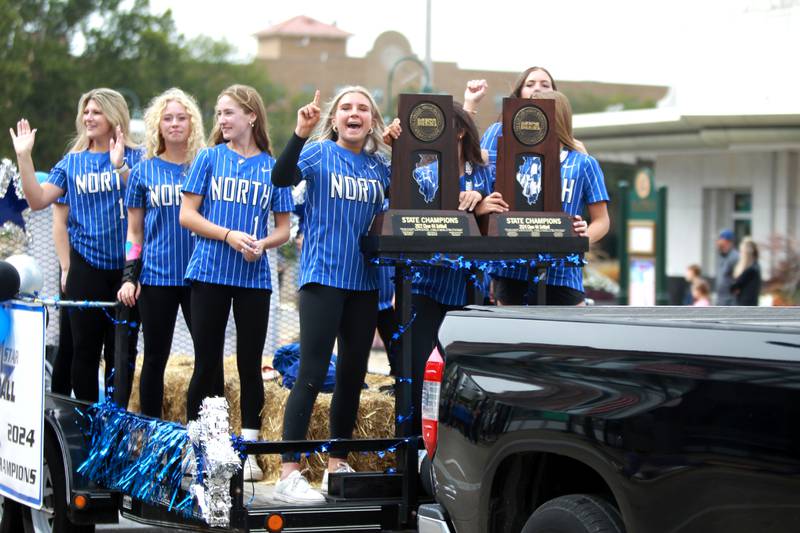 St. Charles North softball players ride on a trailer on Friday, Sept. 27, 2024 during the school’s annual homecoming parade in St. Charles.