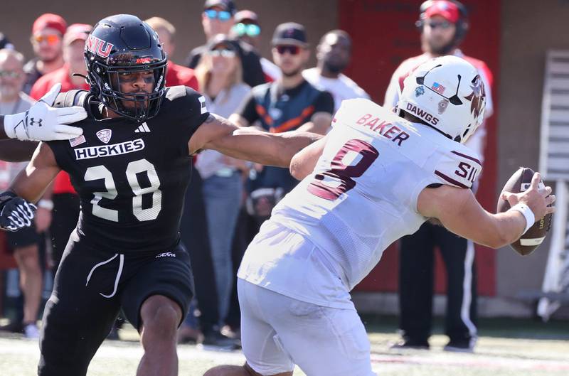 Northern Illinois' Nevaeh Sanders gets pressure on Southern Illinois quarterback Nic Baker during their game Saturday, Sept. 9, 2023, in Huskie Stadium at NIU in DeKalb.