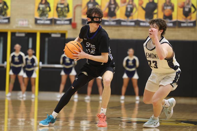 St. Francis’ Tanner Hozian looks for a play against Lemont in the Class 3A Hinsdale South Regional semifinal game on Tuesday, March 3, 2026 in Darien.