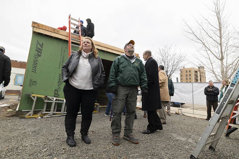 Sterling Main Street director Janna Groharing and WACC building trades instructor Matthew Hicks, look over the progress of the incubator pods Thursday, Dec. 15, 2022 in Sterling.