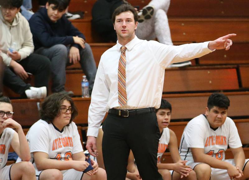DePue boys basketball head coach Trae Blumhorst coaches his team against Midland on Monday, Dec. 19, 2022 at DePue High School.