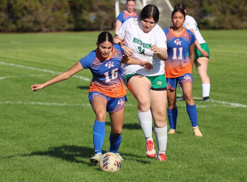 Genoa-Kingston's Alison Ayala (left) keeps possession Thursday, April 23, 2026, during their game against North Boone at Genoa-Kingston High School.