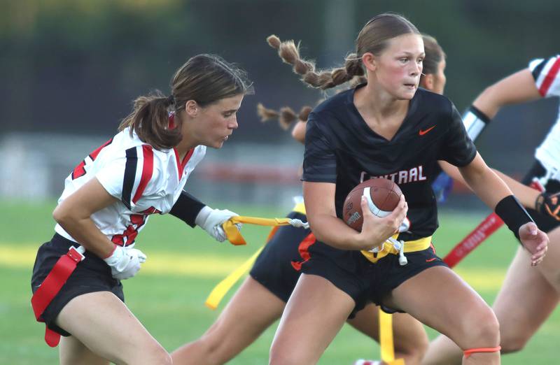 Huntley’s Aubrina Adamik, left, grabs the flag of Crystal Lake Central’s Ryleigh Smith in varsity flag football at Owen Metcalf Field on the campus of Crystal Lake Central High School in Crystal Lake on Tuesday, Sept. 16, 2025.