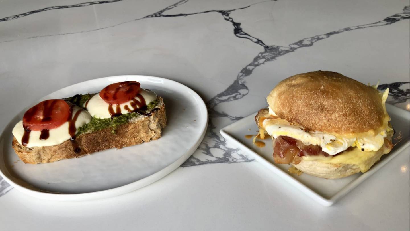 Caprese Toast and Brown Sugar Bacon Gouda sandwich (from left to right) from Oak + Bean, a new coffee shop and wine bar in downtown Oswego.