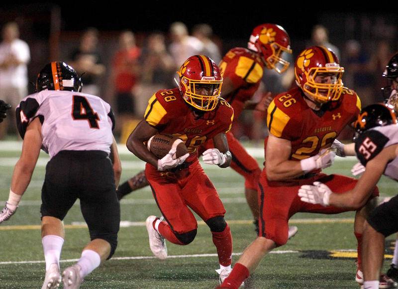Batavia's Art Taylor (28) runs the ball during a home game against St. Charles East Sept. 22. Batavia won the game 7-0.