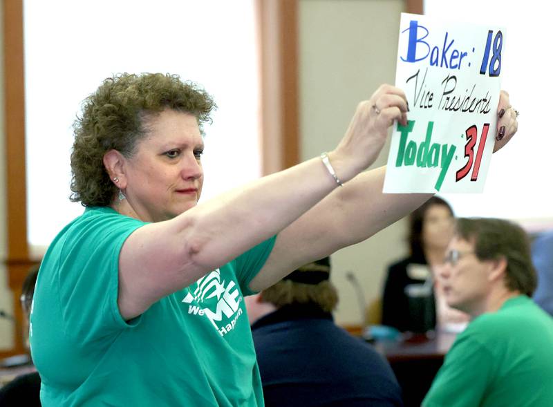 A Northern Illinois University employee and and AFSCME Local 1890 member, holds a sign Thursday, June 12, 2025, during the NIU Board of Trustees meeting in Altgeld Hall at NIU in DeKalb. NIU clerical, professional and administrative workers represented by the American Federation of State, County and Municipal Employees Local 1890 are asking for higher wages when their contract expires at the end of the month.
