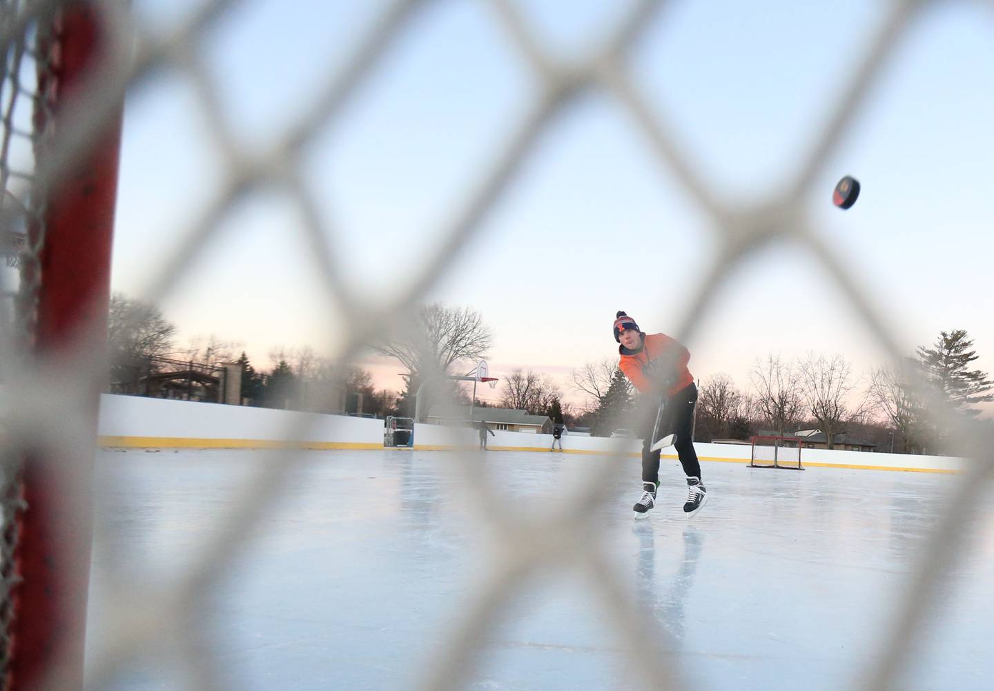 Stuart McGunnigal of Peru, fires a slap shot into the net on Thursday, Dec. 5, 2024 at Washington Park in Peru.