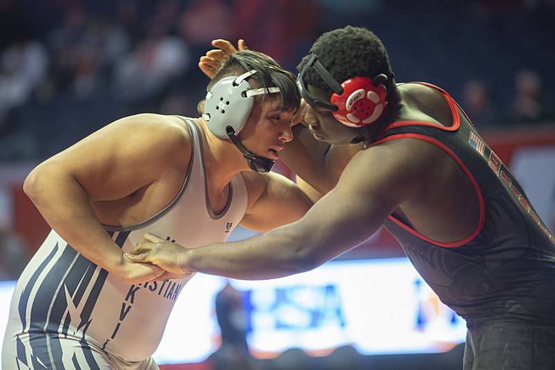 Yorkville Christian's Michael Esquivel (right) and Mooseheart's Joshua Gaye work against one another in 285lbs during the 1A third place match at the IHSA state wrestling meet on Saturday, Feb. 19, 2022.