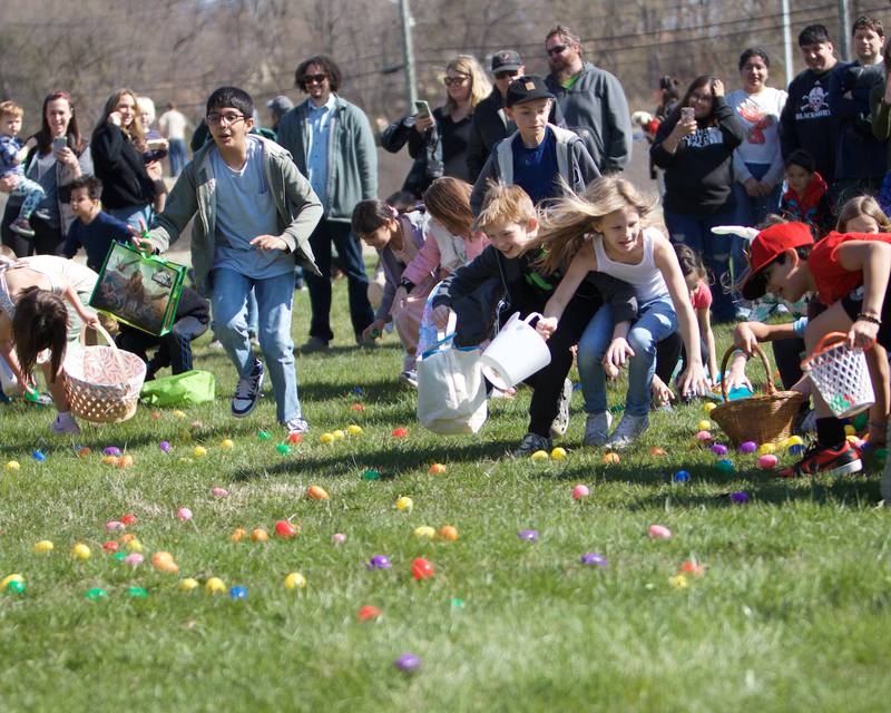 Kids running to find the eggs at the Batavia Easter Egg Hunt at Clark Island Recreation area on Saturday, April 12, 2025 in Batavia.