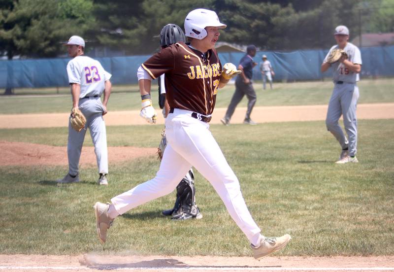 Jacobs’ Jack Celler trots to home plate on a home run against Hononegah in Class 4A Sectional baseball action at Carpentersville Saturday.