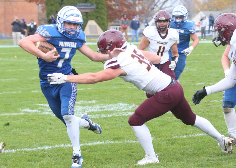 Princeton's Gavin Lanham attemps to get outside of Montini Catholic's Ben Evenson during the Class 3A quarterfinal game on Saturday, Nov. 16, 2024 at Bryant Field in Princeton.
