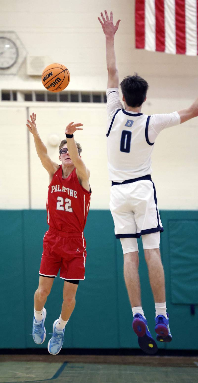 Palatine’s Darrin Dick (22) shoots over Downers Grove South’s Sean Day (0) as time runs out in the first quarter during the Jack Tosh Holiday Tournament Thursday, Dec. 26, 2024 at York High School in Elmhurst.