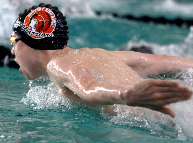 McHenry’s Ian Boland swims the 100-Yard Butterfly during the Fox Valley Conference Swimming Championships at Woodstock North High School Saturday.