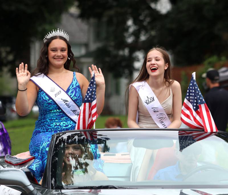Miss McHenry 2025 Adelynn Kuhlemeier, left, and first runner-up Sophie Kwasigroch ride on a. Convertible as the Fiesta Days Parade makes its way down Main Street in McHenry on Sunday, July 20, 2025.