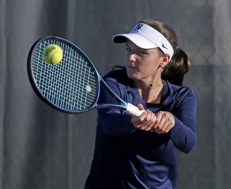 Nazareth Academy's Elaine McNamara returns the ball Thursday, Oct. 23, 2025, during the first day of the IHSA State Girls Tennis Tournament at Schaumburg High School.