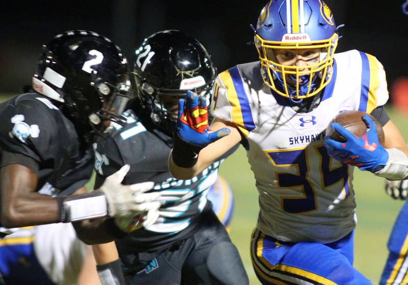 Johnsburg’s Duke Mays runs the ball in varsity football on Friday Sept. 27, 2024, at Woodstock North High School in Woodstock.
