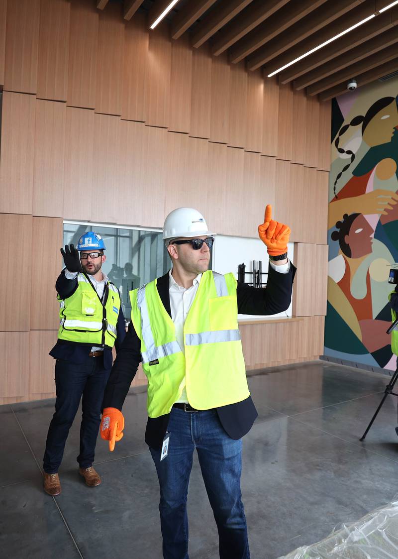 Matt Sexton, community development manager at Meta, (right) and Stefan Kasan, infrastructure construction manager and site lead at Meta, point out some features Wednesday, April 27, 2022, during a tour at the Meta DeKalb Data Center .