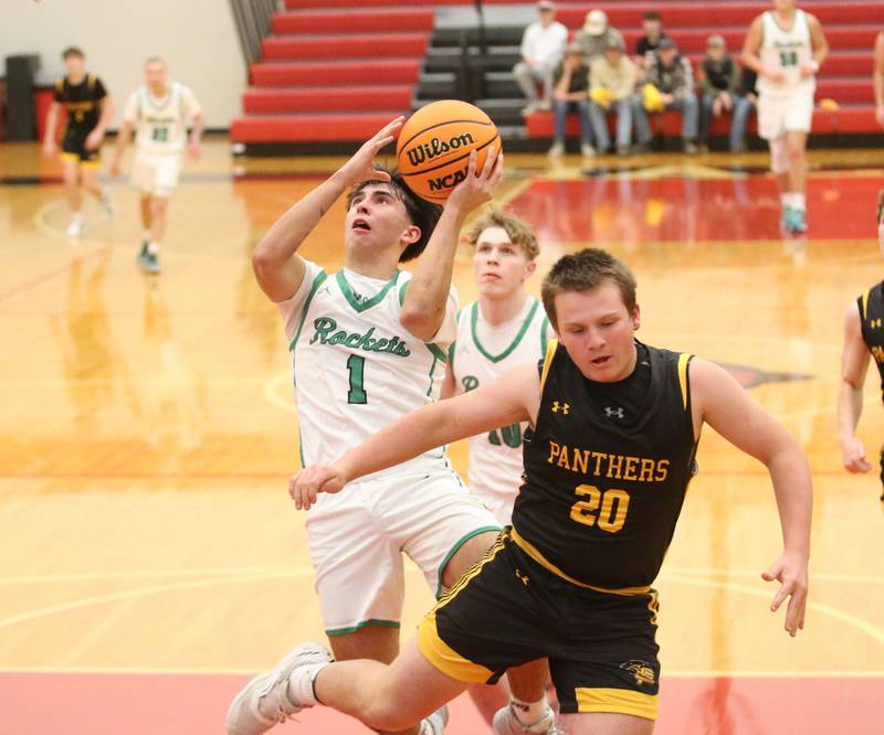 Rock Falls's Austin Castaneda eyes the hoop against Putnam County's AJ Furar during the 50th annual Colmone Classic on Monday, Dec. 9, 2024 at Hall High School.