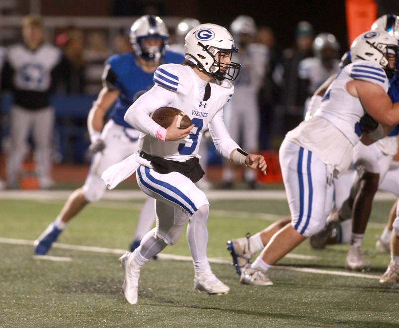 Geneva quarterback Nate Stempowski keeps the ball during a game against St. Charles North in St. Charles on Friday, Oct. 20, 2023.