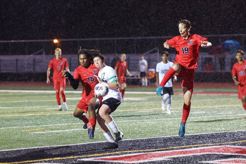 Bradley-Bourbonnais' Cencere Smith and Bishop McNamara's Kaiden Hunt collide  as Bradley-Bourbonnais' Jack Martin, right, approaches during the Boilermakers' 9-0 victory over Bishop McNamara in an All-City match up on Wednesday, Sept. 3, 2025.