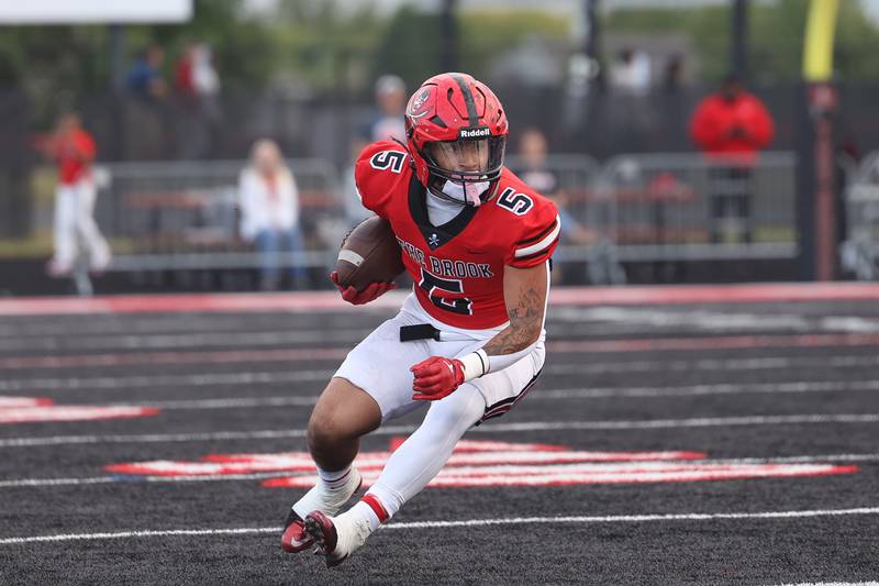 Bolingbrook’s Darnell Stephens cuts upfield after a catch against Naperville North on Friday, Sept. 8, 2023 in Bolingbrook.