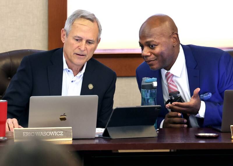 Northern Illinois University Board of Trustees Chair Eric Wasowicz (left) talks to General Counsel Bryan Perry prior to the meeting Thursday, Sept. 21, 2023, in Altgeld Hall on campus in Dekalb. NIU employees, most represented by the American Federation of State, County and Municipal Employees, spoke out at the meeting seeking a fast resolution to a contract with higher wages.
