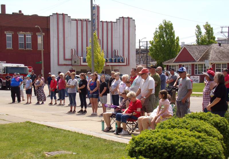 Attendees of the Streator Memorial Day ceremony gather on Hickory Street to watch the program at Veterans Plaza in City Park. Others crowded in the shade of the former Veterans of Foreign Wars building and underneath trees inside the park.