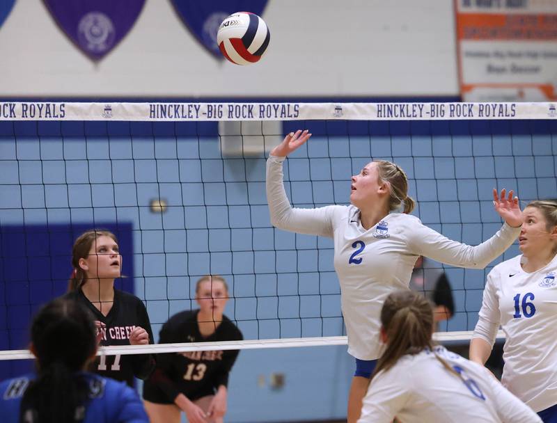 Hinckley-Big Rock's Anna Herrmann tips the ball over the net to Indian Creek's Cheyenne Buh during their match Tuesday, Sept. 24, 2024, at Hinckley-Big Rock High School.