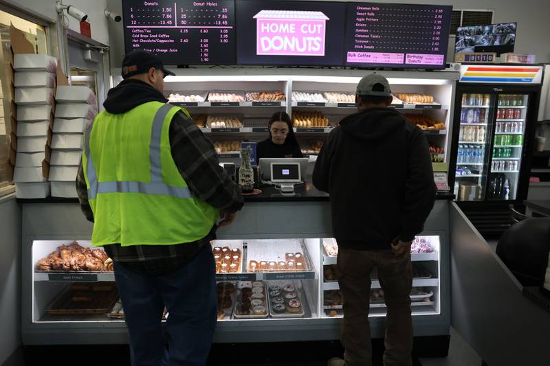 Customers place orders at Home Cut Donuts on Jefferson Street, Saturday, March 25, 2023 in Joliet.