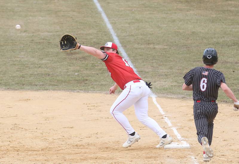 Hall's Hunter Edgcomb is called safe as Streator first baseman Cole Winterrowd steps off of the bag on Tuesday, March 18, 2025 in Foley Field at Kirby Park in Spring Valley.