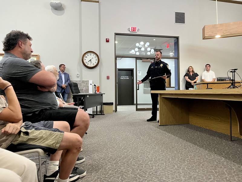Dixon's new chief of police Ryan Bivins (middle left) talks about his plans for the future of the department after being sworn in at Monday's Dixon City Council meeting, June 2, 2025.