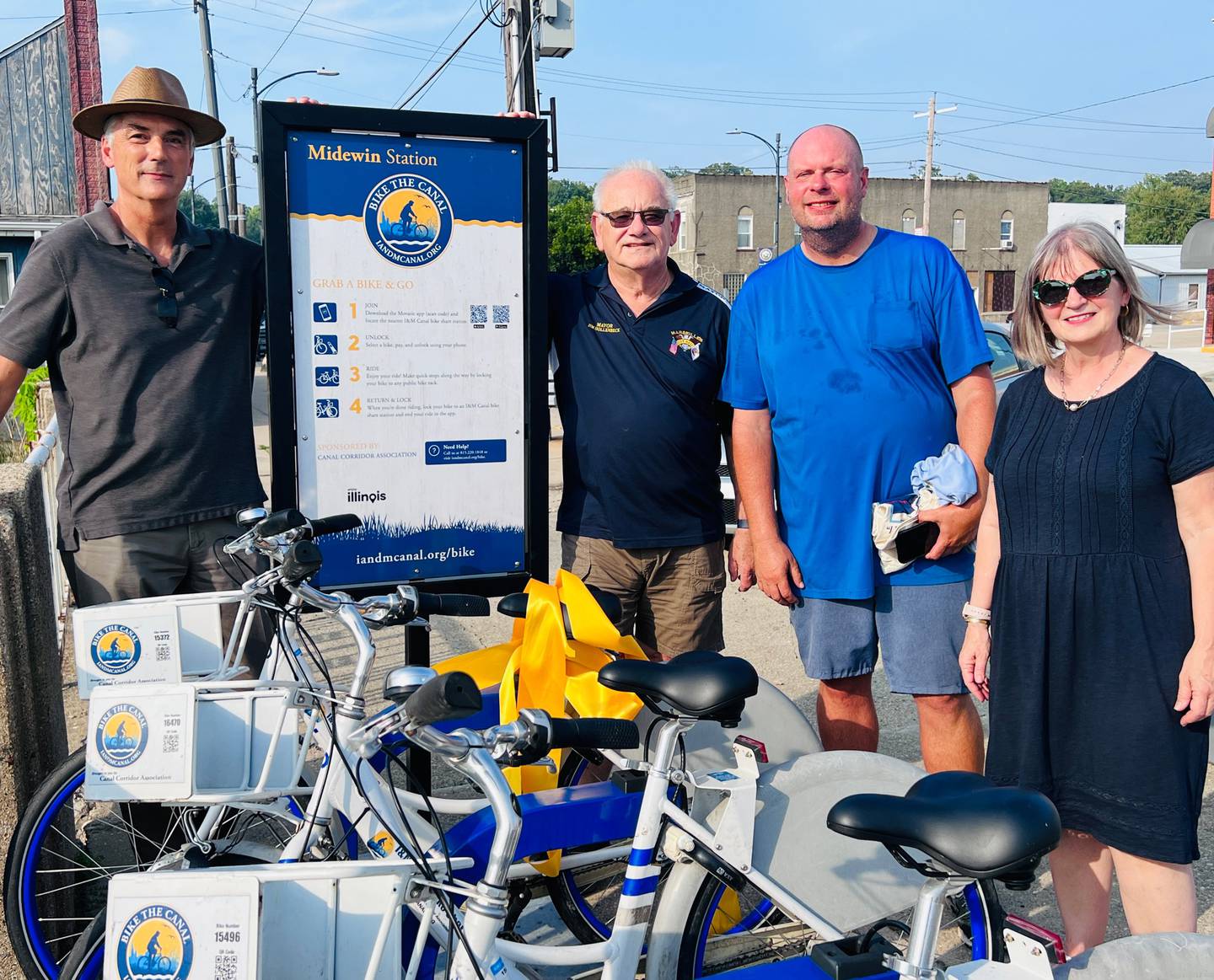 Executive Director of Ottawa Area Chamber of Commerce and Industry Jeff Hettrick, Commissioner Michael Scheib, Marseilles Mayor Jim Hollenbeck and I&M Canal National Heritage Area president, Ana Koval celebrate the ribbon cutting of Marseilles' new bike station. (Photo provided by I&M Canal NHA)