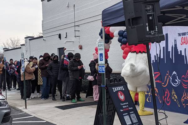 Customers line up in the cold at Zaxby’s in Plainfield for chance for free chicken